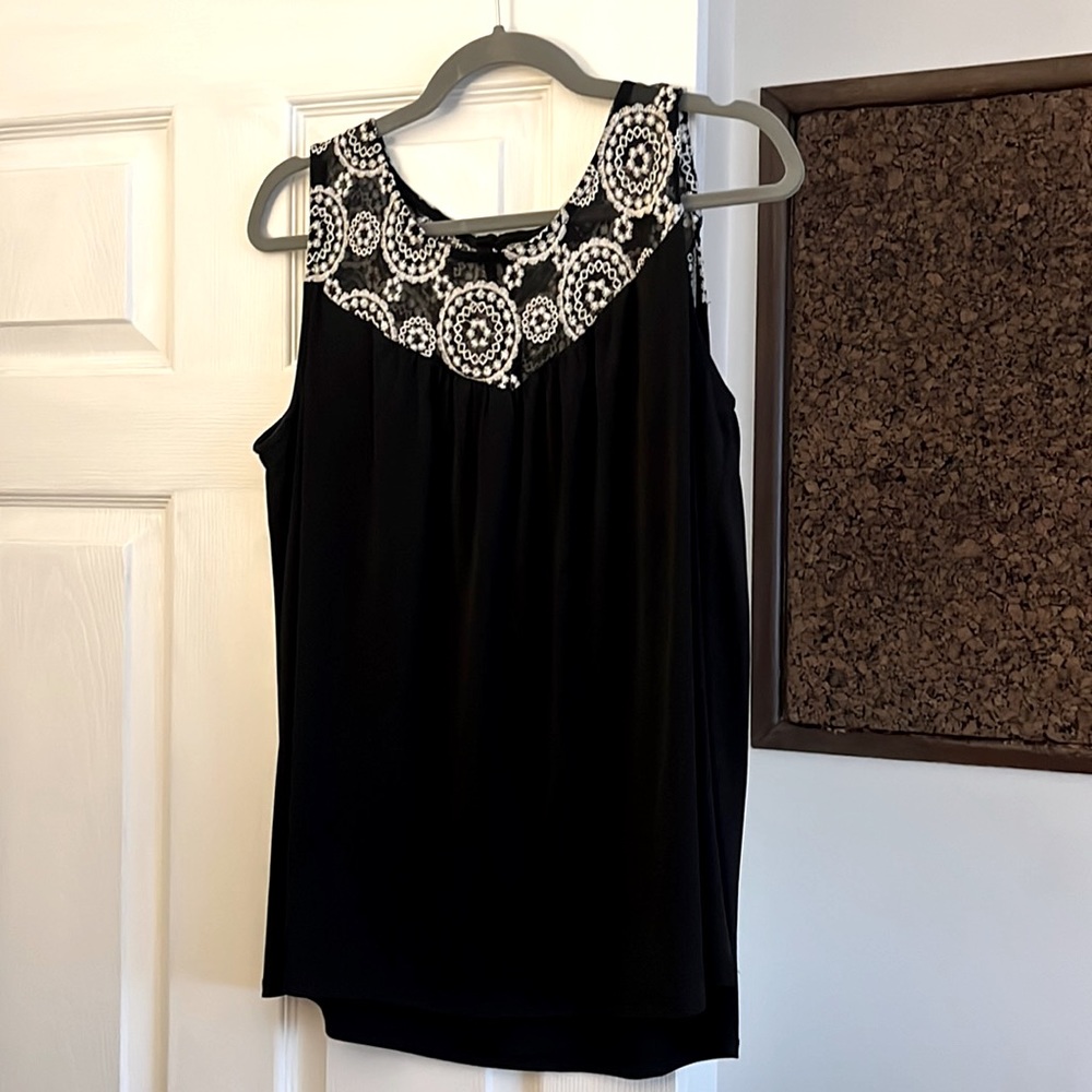 Sleeveless black top with an embroidered yolk.  Size 1x